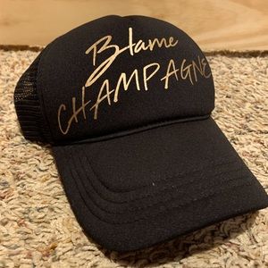 Blame Champagne Trucker Hat